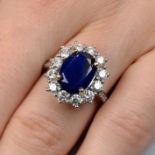 An 18ct gold sapphire and brilliant-cut diamond cluster ring.