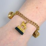 A late Victorian gold curb-link charm bracelet,