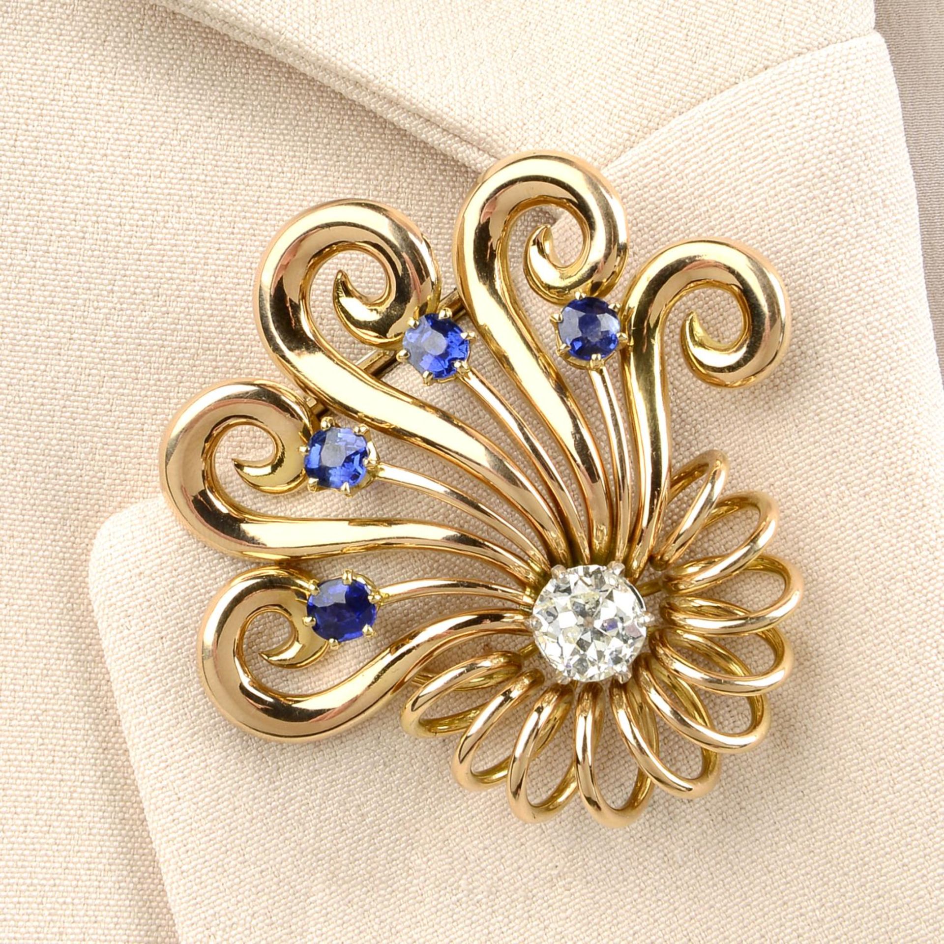 A 1940s 18ct gold old-cut diamond and sapphire clip brooch,
