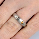 A platinum vari-cut diamond and coloured diamond band ring.Total diamond weight 1.33cts,