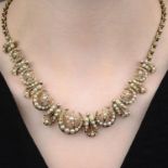 A late Victorian gold split pearl crescent moon and star necklace.Length 41.5cms.