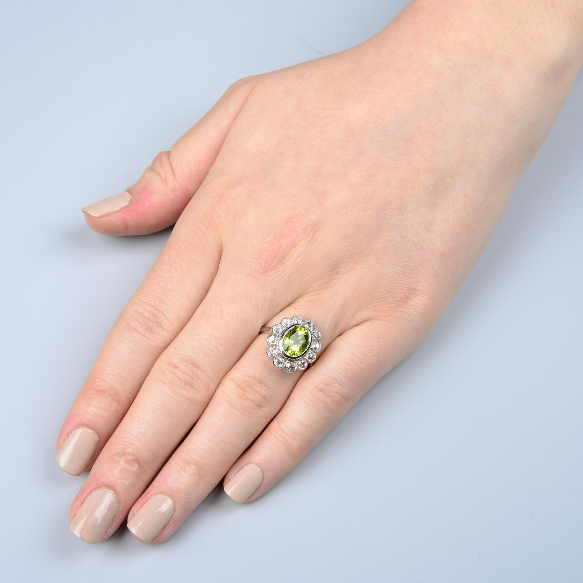 A peridot and old-cut diamond floral cluster ring. - Image 5 of 5