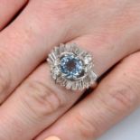 An aquamarine and vari-cut diamond crossover cluster ring.