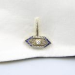 A pair of Art Deco gold vari-cut diamond and sapphire cufflinks.Estimated total diamond weight