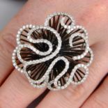 A diamond abstract floral dress ring.