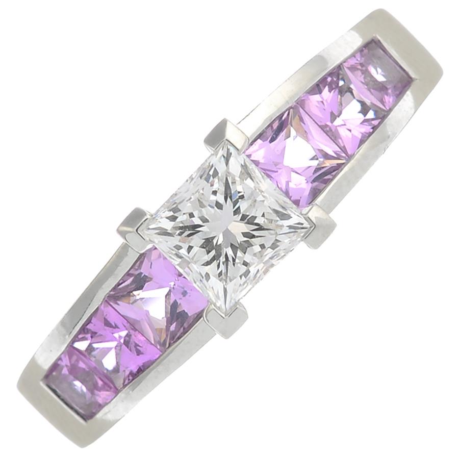 A platinum diamond single-stone ring, with square-shape pink sapphire line gallery and shoulders. - Image 4 of 5