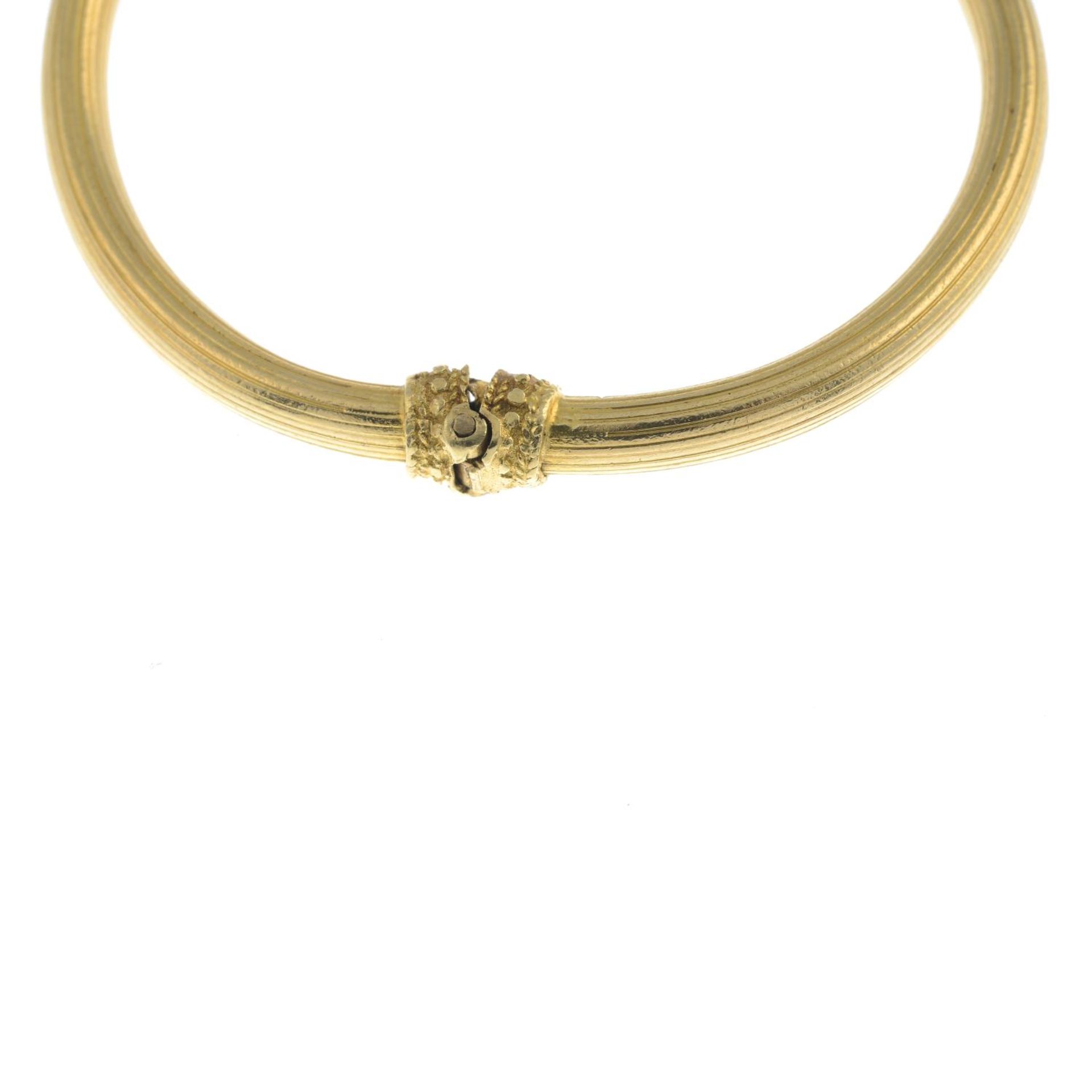 A ram's head hinged bangle, with ruby eyes, by Ilias Lalaounis.Stamped 750. - Image 3 of 5