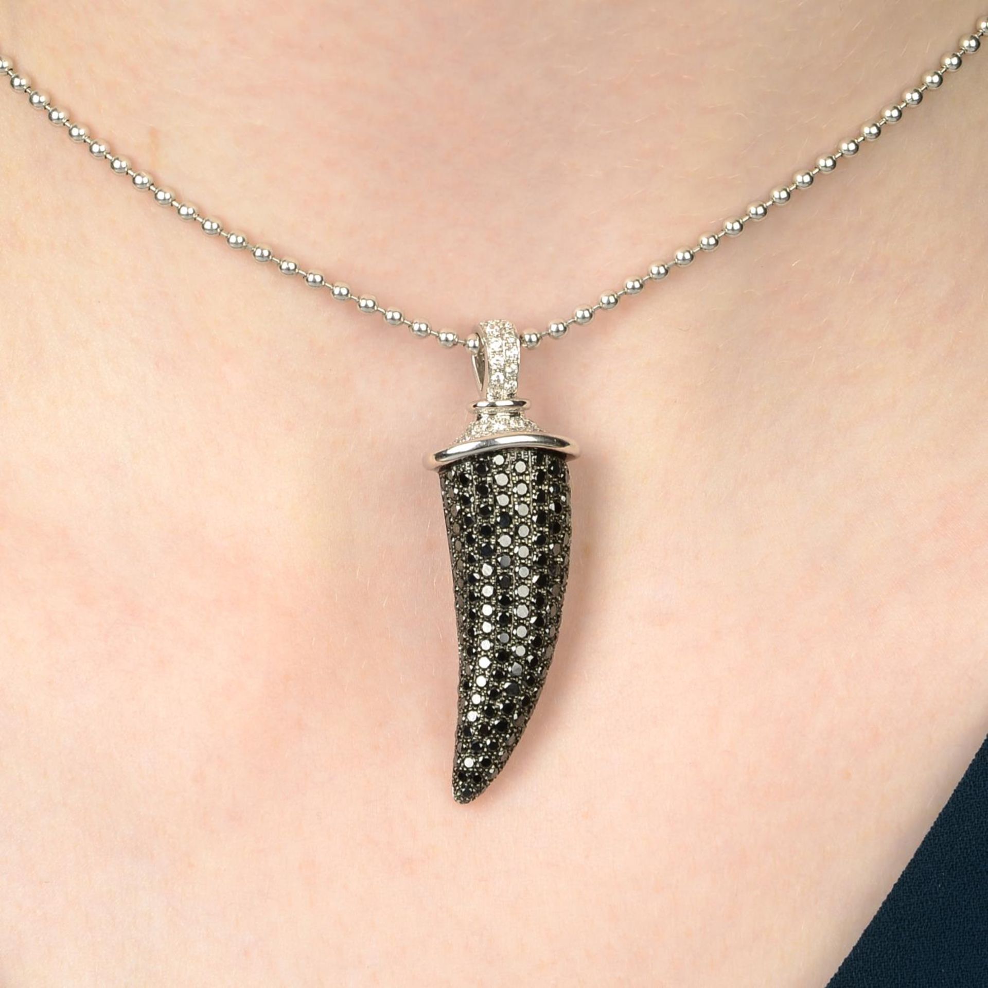 An 18ct gold diamond and black diamond 'Horn' pendant,