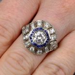 A brilliant-cut diamond and sapphire cluster ring.Principal diamond estimated 1ct,