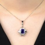 A tanzanite and vari-cut diamond ray cluster pendant, with 9ct gold chain.