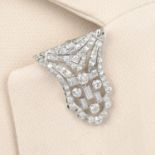 An Art Deco brilliant and baguette-cut diamond clip.Estimated total diamond weight 3cts,