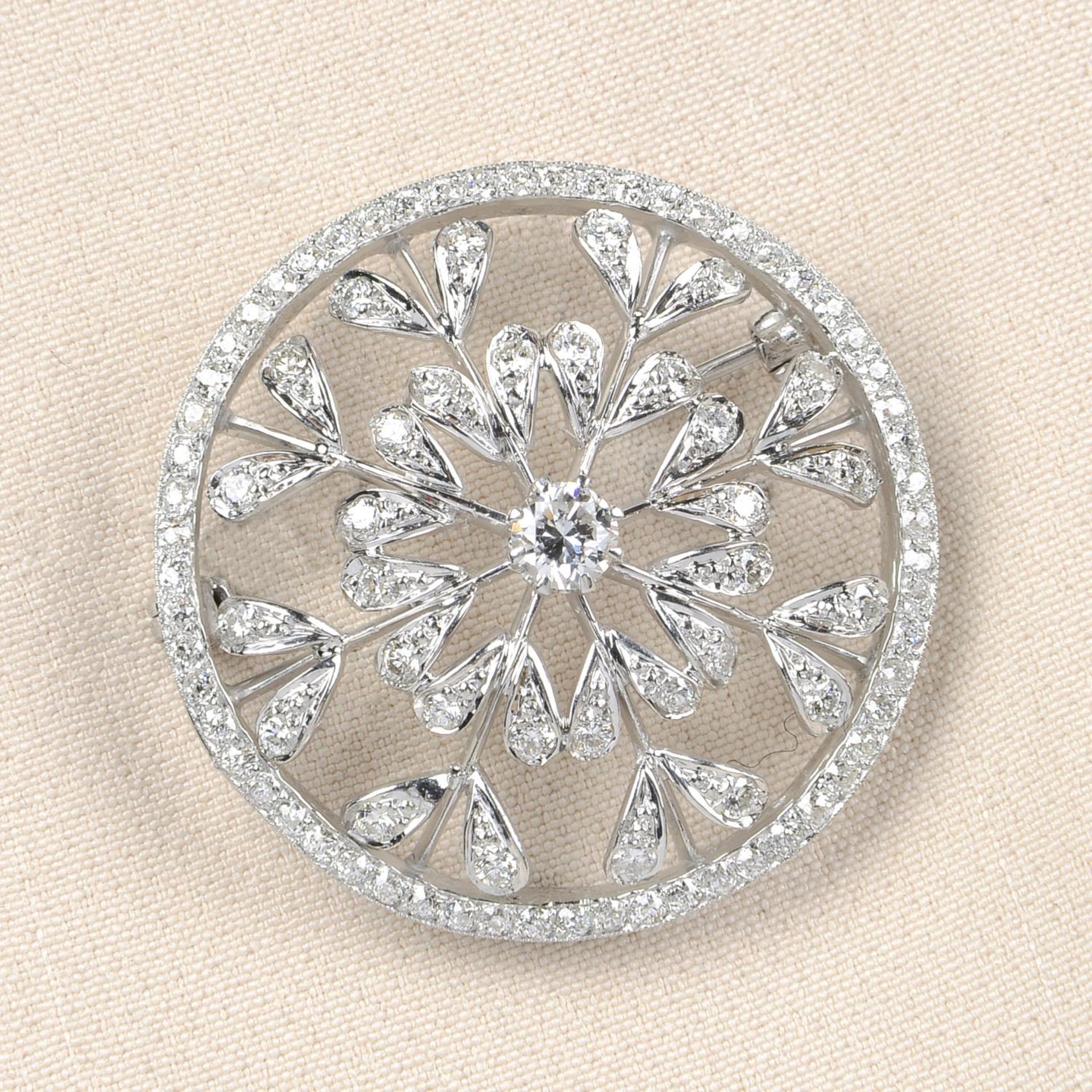 A diamond openwork floral brooch.Principal diamond estimated weight 0.35ct,