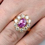 A pink sapphire and brilliant-cut diamond cluster ring.Estimated total diamond weight 1.50cts,