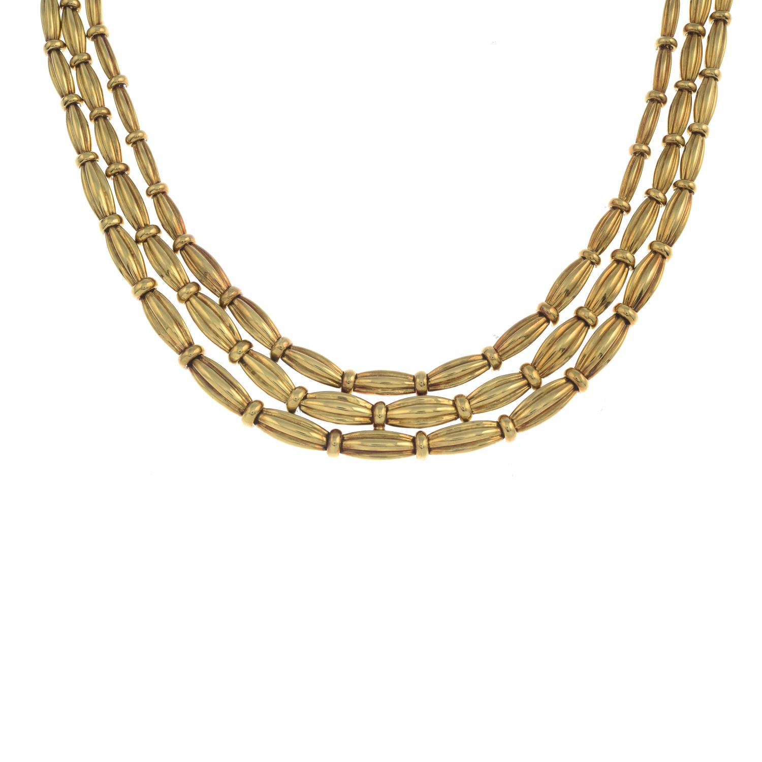 A grooved link, three-strand necklace, by Tiffany & Co.Stamped 750. - Image 4 of 5