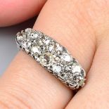 An early 20th century 18ct gold old-cut diamond two-row ring.Estimated total diamond weight