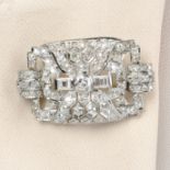 A mid 20th century platinum old-cut diamond pierced geometric brooch.Principal diamond estimated