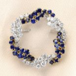 A mid 20th century brilliant-cut diamond and sapphire interwoven wreath brooch.Estimated total