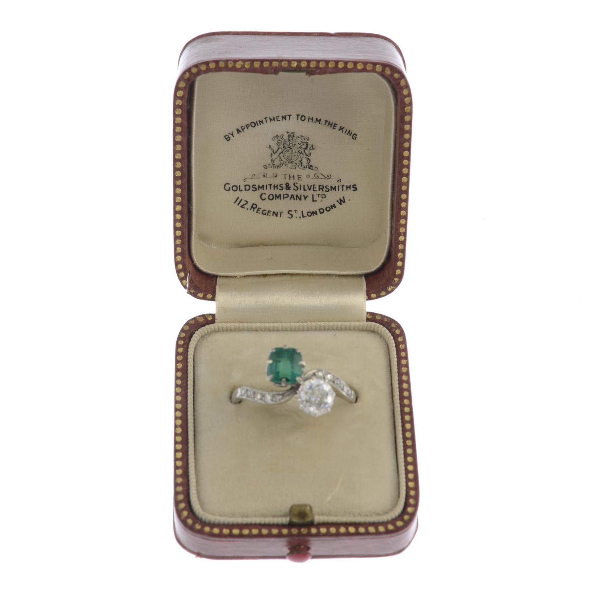 An early 20th century platinum emerald and old-cut diamond two-stone crossover ring, - Image 2 of 4