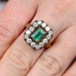 An emerald and brilliant-cut diamond cluster ring.