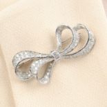 A mid 20th century platinum diamond bow brooch.