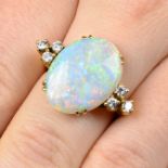 An oval opal cabochon and brilliant-cut diamond dress ring.Estimated dimensions of opal 19 by 15 by