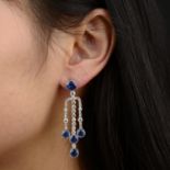 A pair of sapphire and diamond articulated drop earrings.