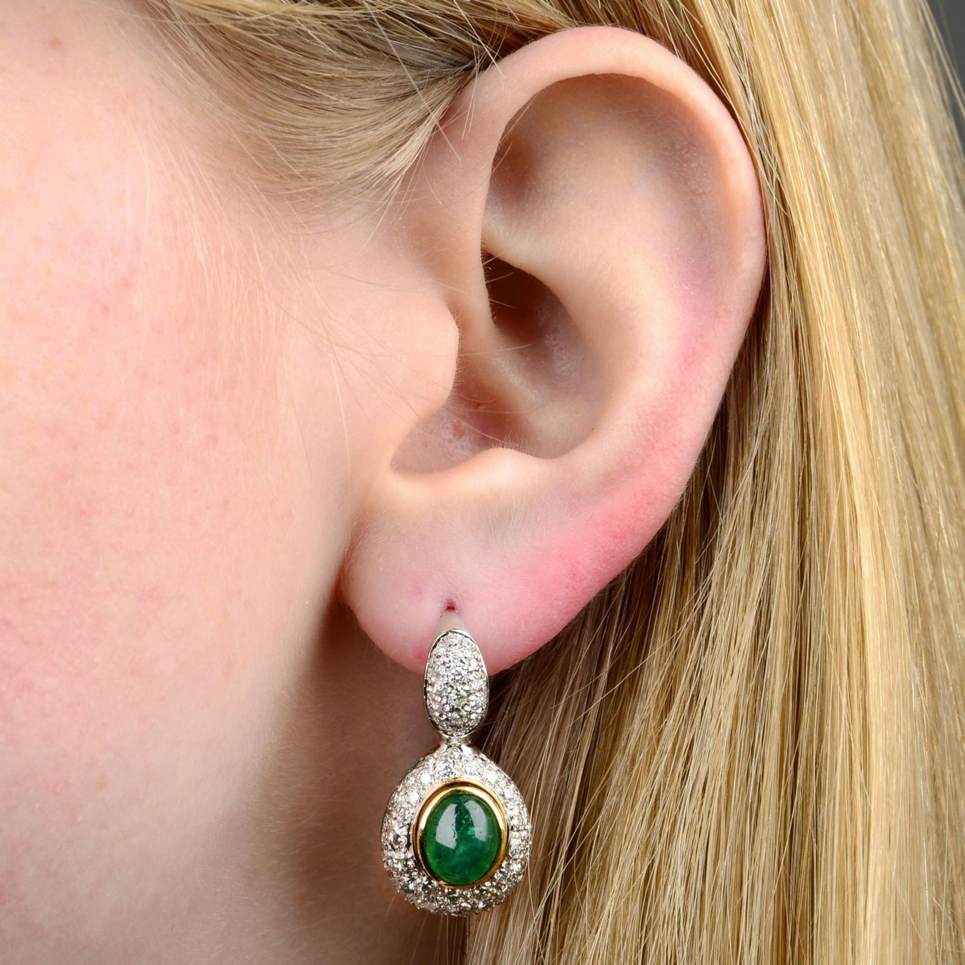 A pair of emerald cabochon and pave-set diamond earrings.Estimated total diamond weight 2cts,