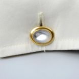 A pair of Edwardian 18ct gold moonstone cufflinks.