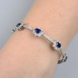 An oval-shape sapphire and brilliant-cut diamond floral cluster bracelet.Total sapphire calculated