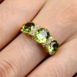 An early 20th century gold oval-shape demantoid garnet and old-cut diamond dress ring.Estimated