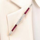 An Art Deco 18ct gold and platinum, Burmese ruby and diamond bar brooch.