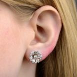 A pair of mid 20th century platinum diamond floral earrings.