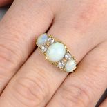 An early 20th century 18ct gold oval opal cabochon and old-cut diamond dress ring.Principal opal