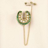 A mid Victorian Royal Presentation 15ct gold emerald and split pearl horseshoe brooch.Engraved