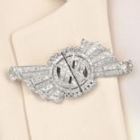 A mid 20th century platinum circular-cut diamond double clip brooch.Estimated total diamond weight