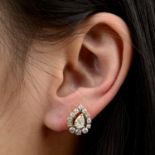 A pair of pear-shape diamond stud earrings,