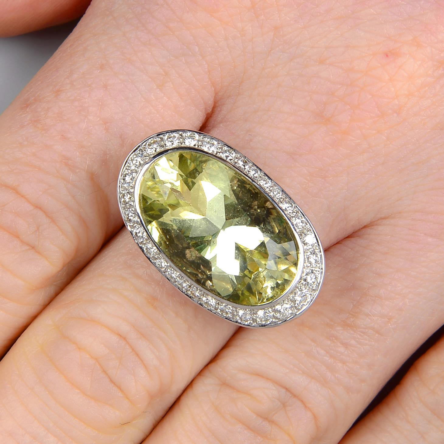 An 18ct gold prasiolite, diamond and tsavorite garnet dress ring.