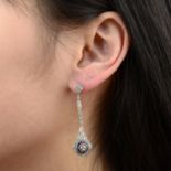 A pair of vari-cut diamond and calibre-cut sapphire openwork earrings.Estimated total diamond