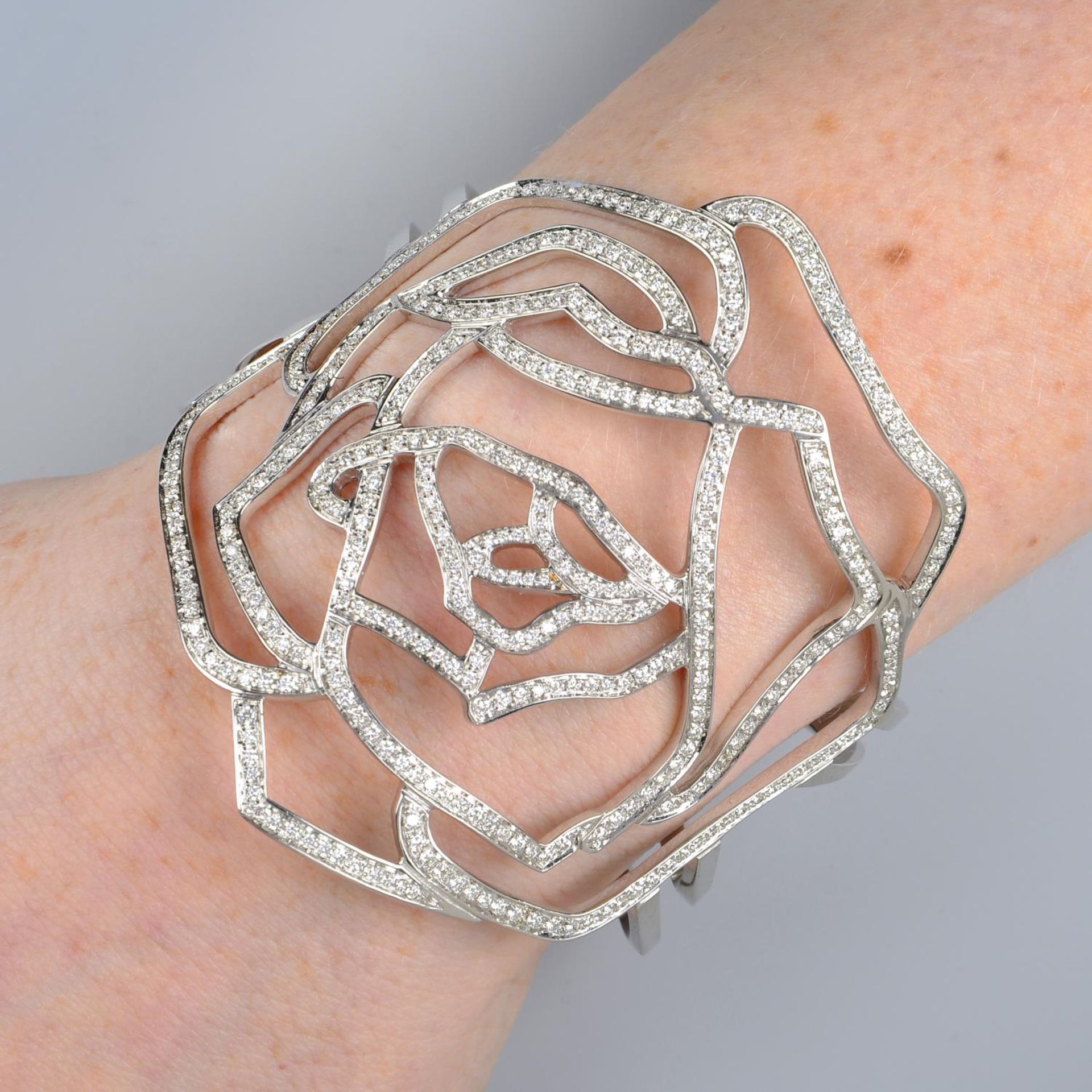 A pave-set diamond openwork rose cuff bangle, by Gavello.