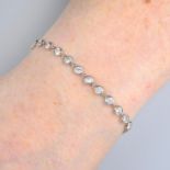 A brilliant-cut diamond bracelet, with pave-set diamond clasp.