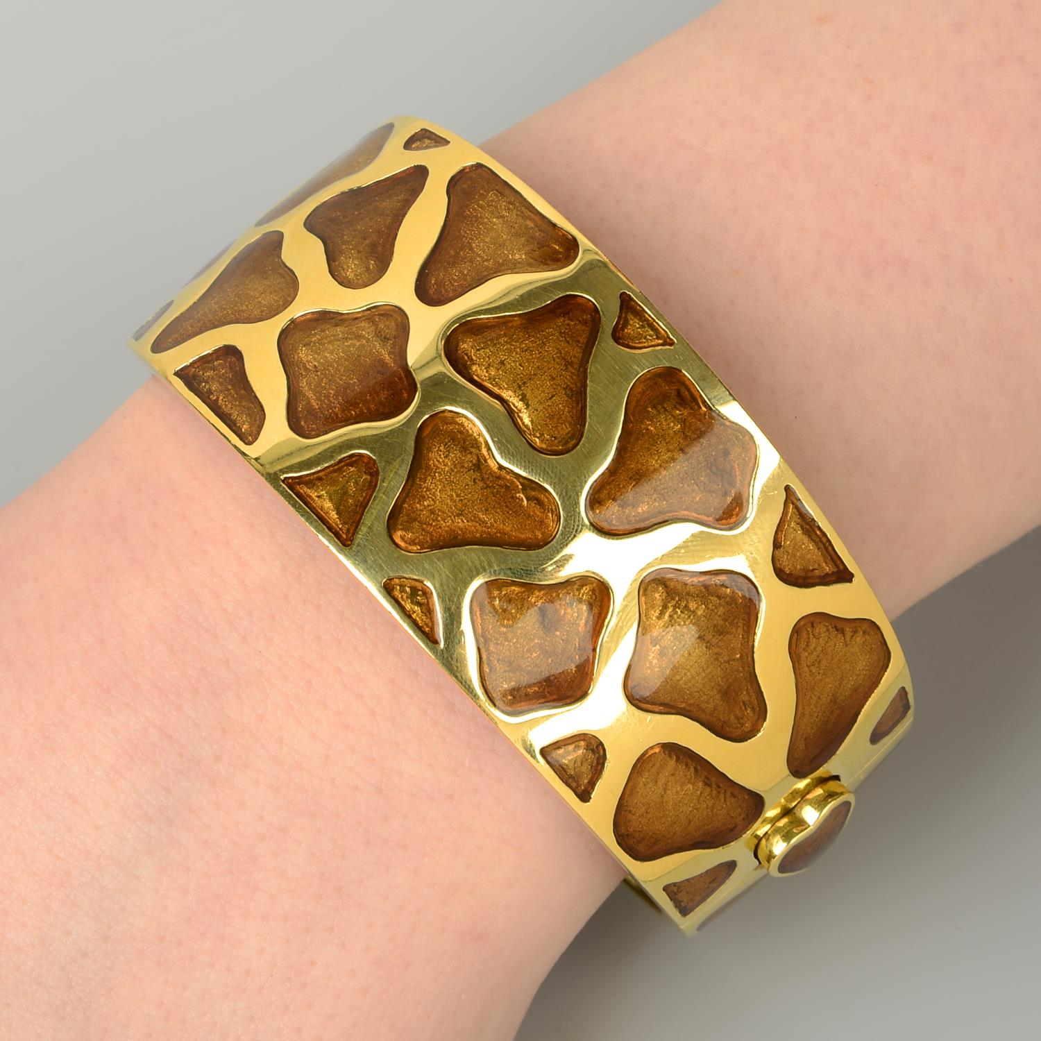 An 18ct gold enamel 'Giraffe' bangle, by Roberto Coin.Hallmarks for Birmingham.