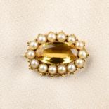 A Victorian gold yellow topaz and split pearl brooch.Topaz weight 7.54cts.Length 2.8cms.