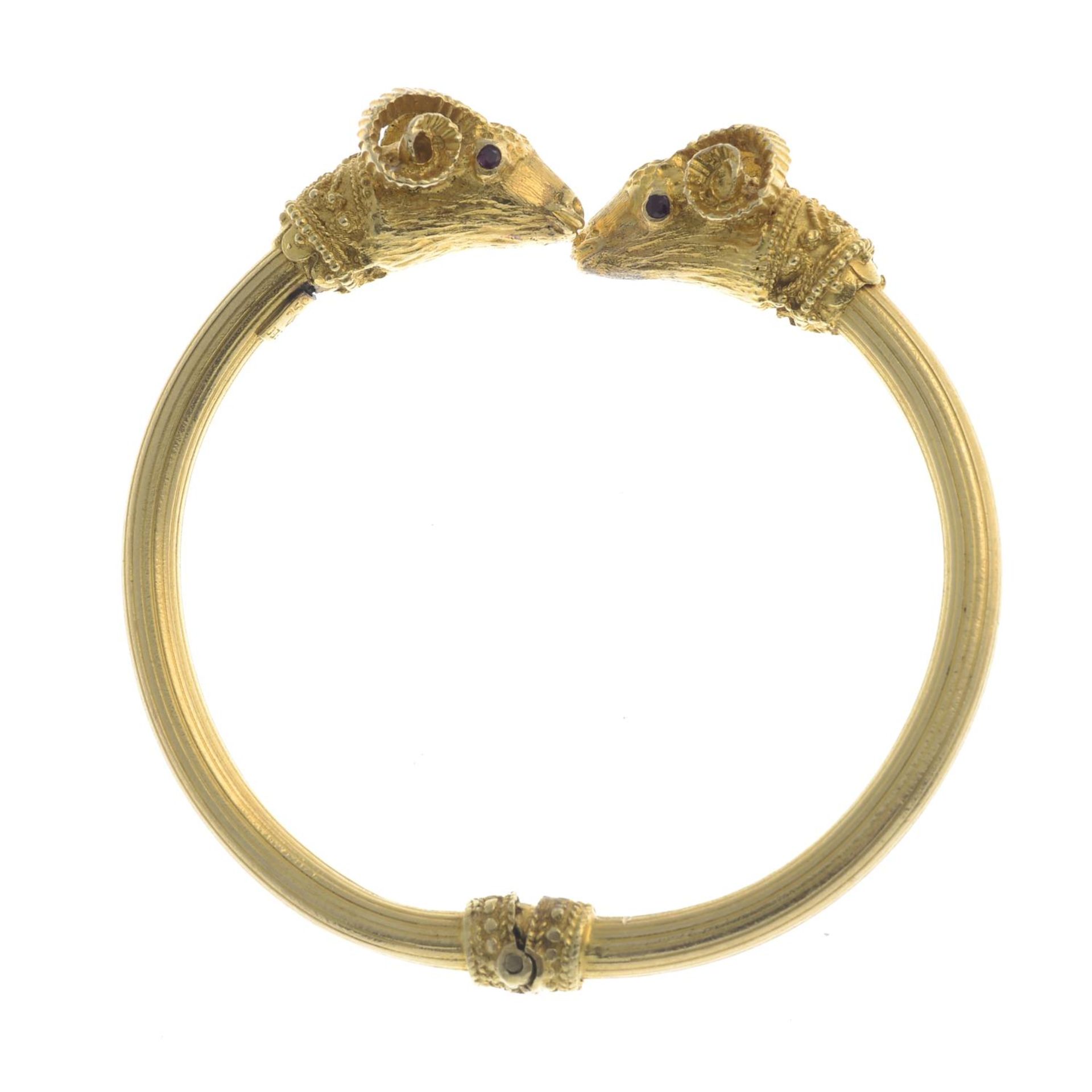 A ram's head hinged bangle, with ruby eyes, by Ilias Lalaounis.Stamped 750. - Image 2 of 5