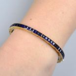 A calibre-cut Burma sapphire hinged bangle,