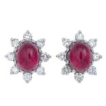 A pair of cabochon ruby and brilliant-cut diamond cluster earrings.Total ruby weight 6.62cts,