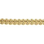 An 18ct gold fancy-link bracelet, with circular garnet cabochon clasp.