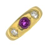 An early 20th century gold ruby and old-cut diamond three-stone ring.Ruby weight 0.68ct.Estimated