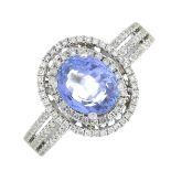An oval-shape sapphire and brilliant-cut diamond cluster ring.Sapphire calculated weight 1.68cts,