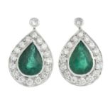 A pair of pear-shape emerald and brilliant-cut diamond cluster earrings.Emerald calculated weights