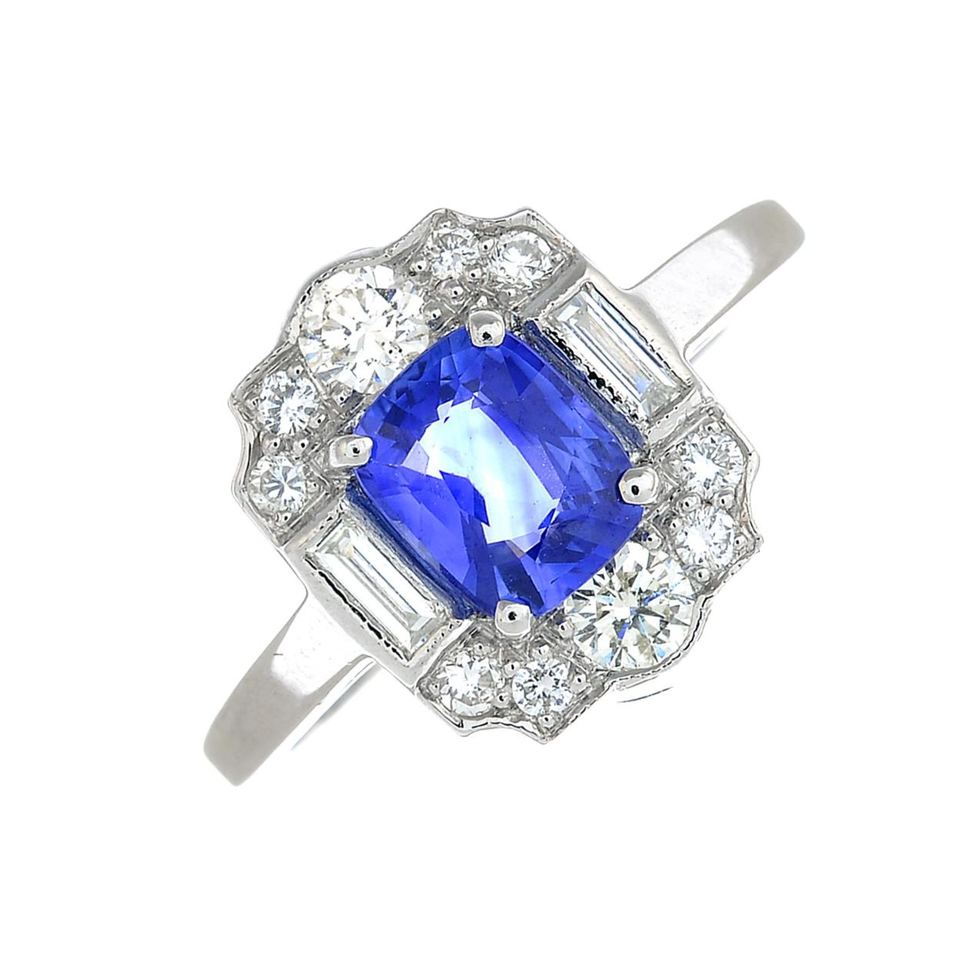 A cushion-shape sapphire and vari-cut diamond cluster ring.Sapphire calculated weight 1.01cts,